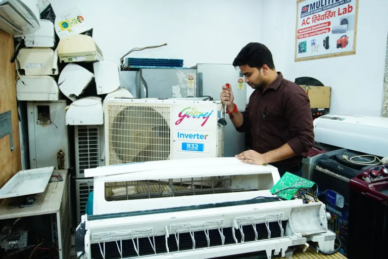 Technician servicing a split air conditioner indoor unit