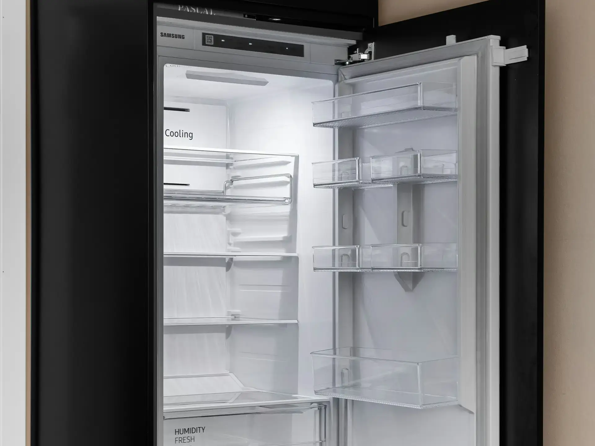 Refrigerator open for inspection with interior light on