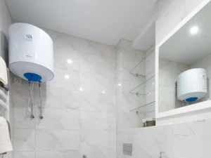 Wall-mounted water geyser in a modern bathroom