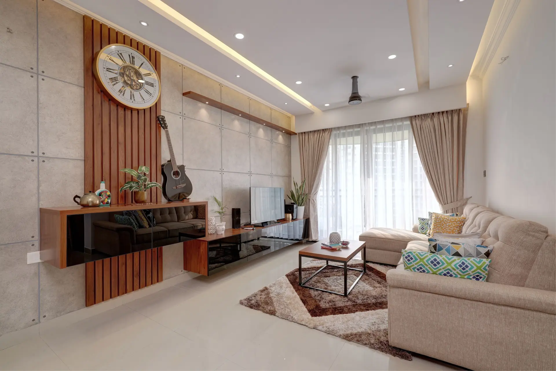 Bright modern Indian living room with sofa and wooden accents